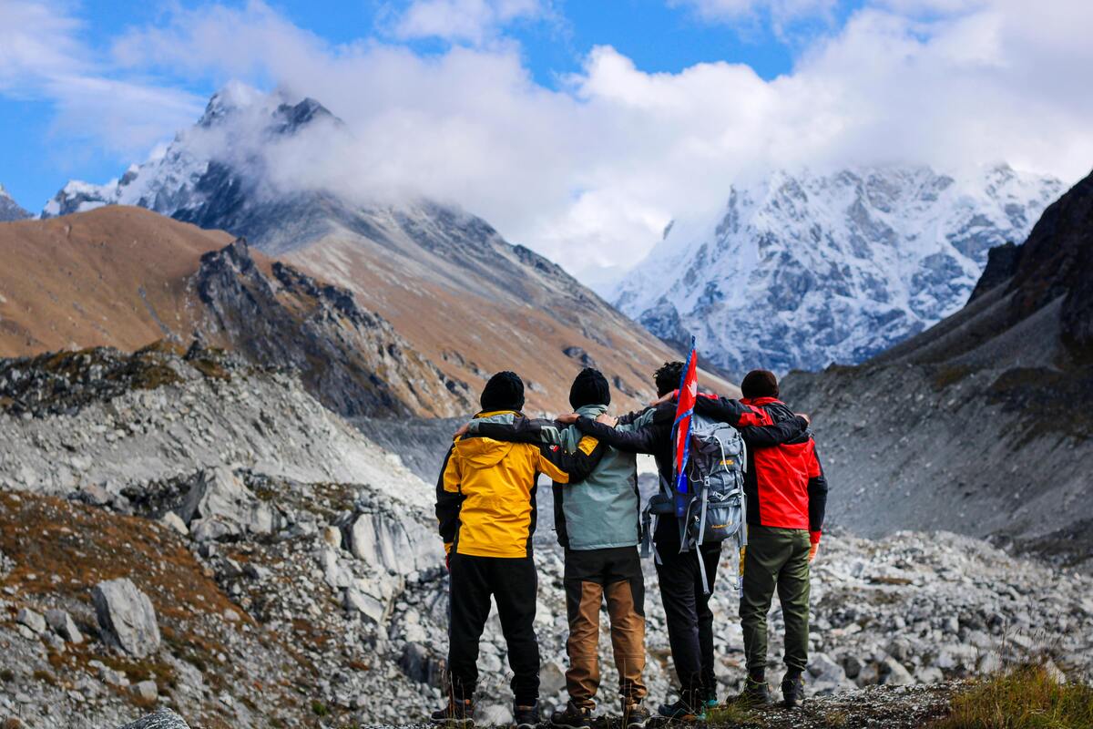 Trekkers practicing responsible travel in a Himalayan mountain village