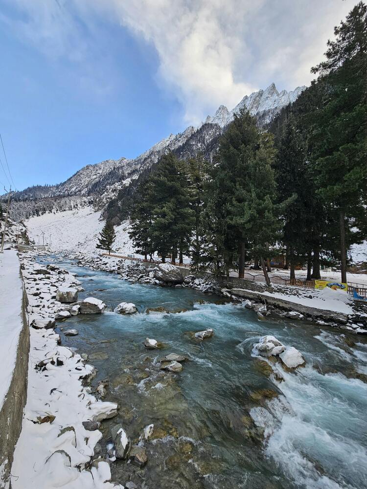 Himalayan mountains with reduced snowfall showing patchy snow cover during winter