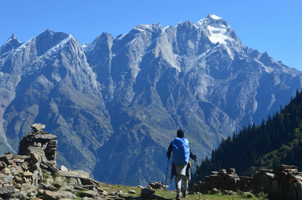 Responsible traveler walking through a Himalayan village respecting local culture and environment